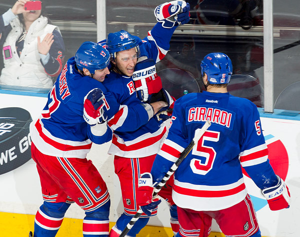 Rangers captain Ryan Callahan celebrates his overtime goal with teammates Brandon Dubinsky and Dan Girardi